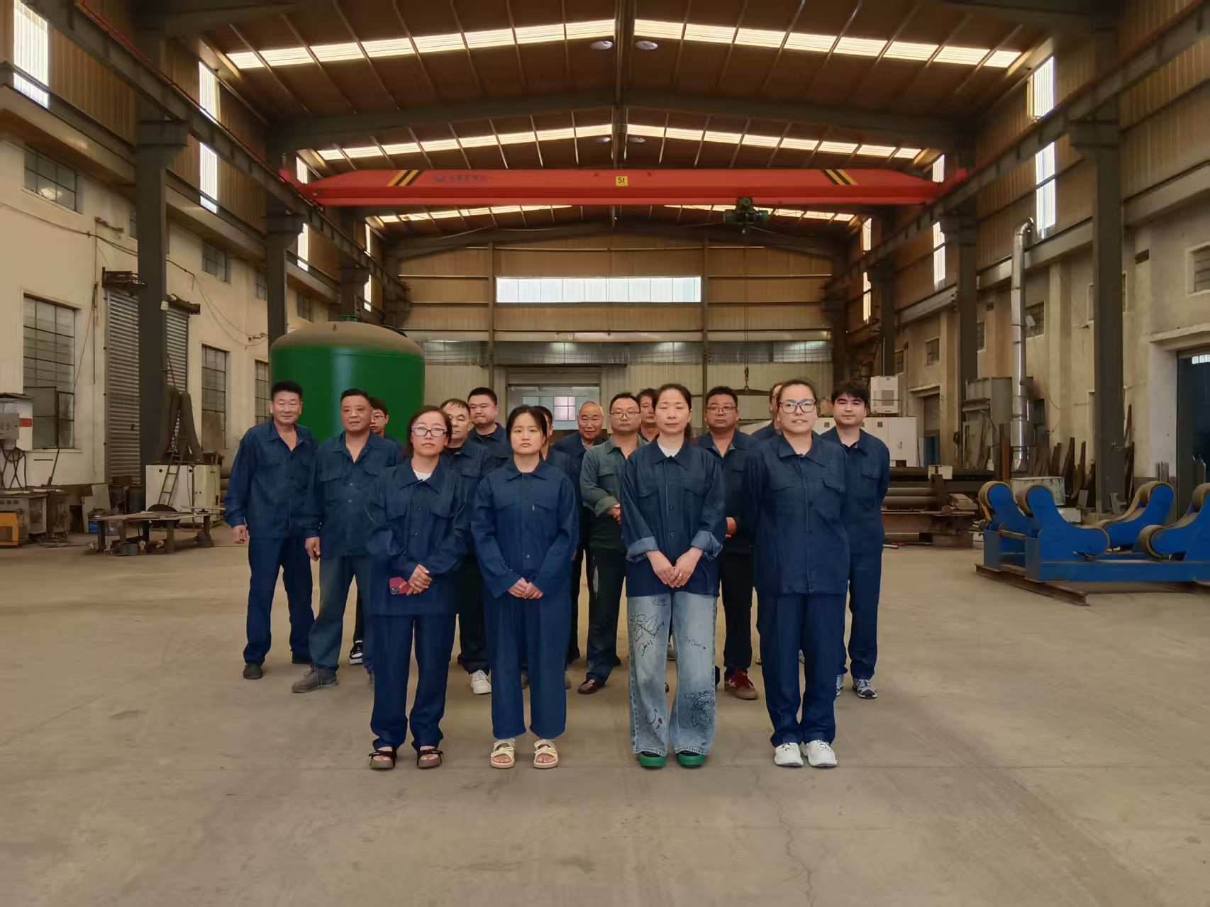 JIE NENG production team standing in the fabrication workshop